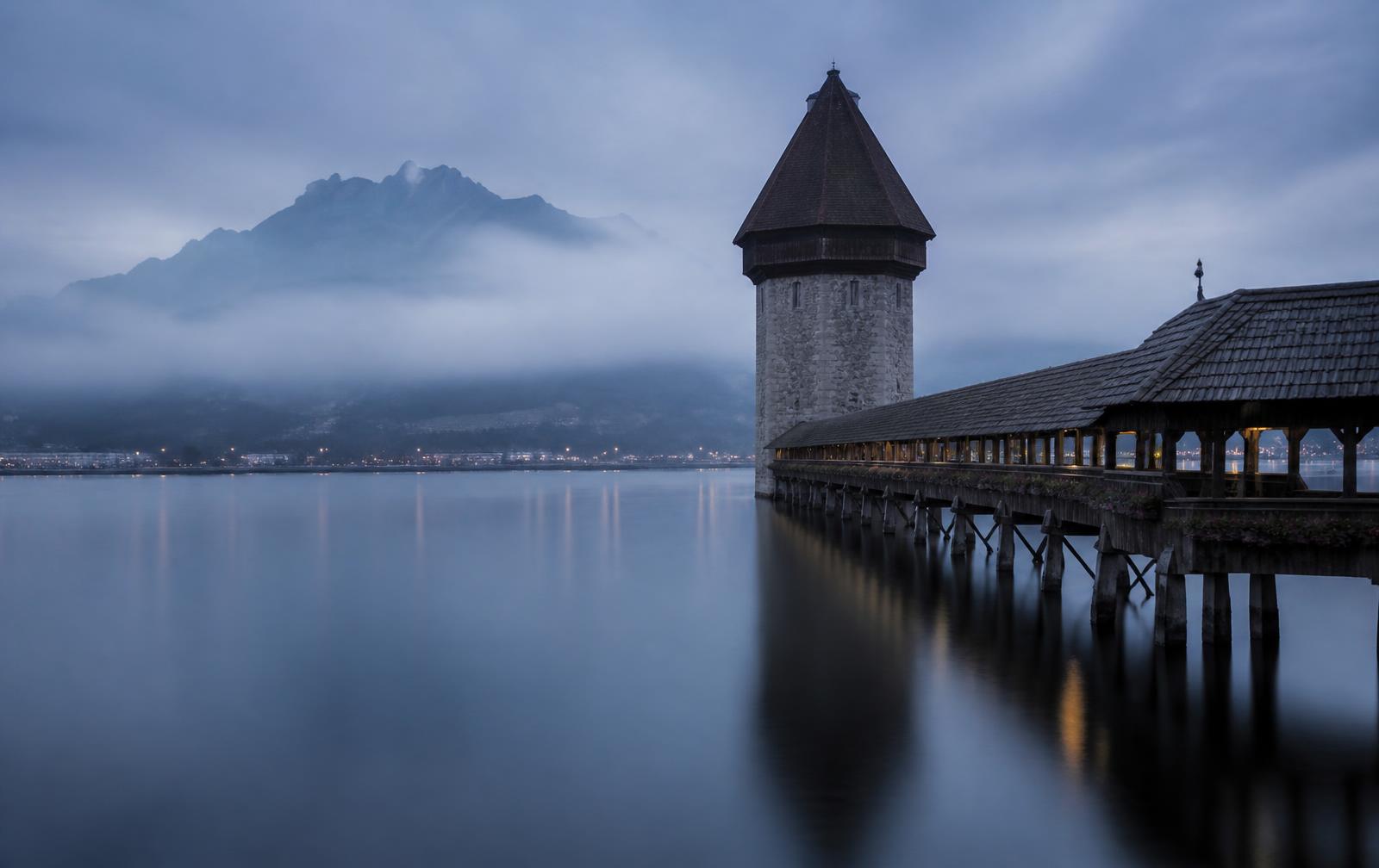 Lucerne at blue hour, lake and mountains in soft fog